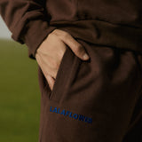 COFFEE SWEATPANTS WITH BLUE EMBROIDERY